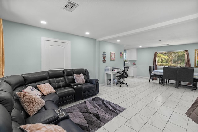 living room featuring marble finish floor, baseboards, visible vents, and recessed lighting