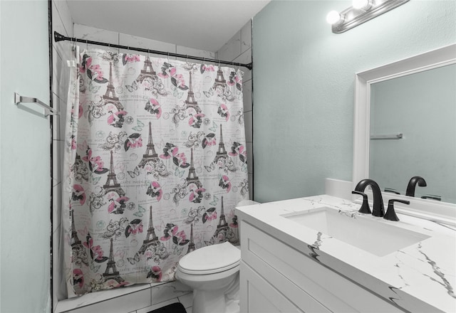 full bath featuring toilet, vanity, and curtained shower