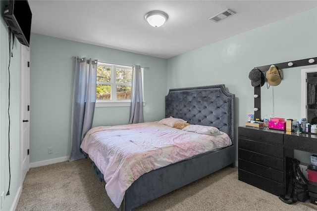 bedroom with carpet flooring and visible vents