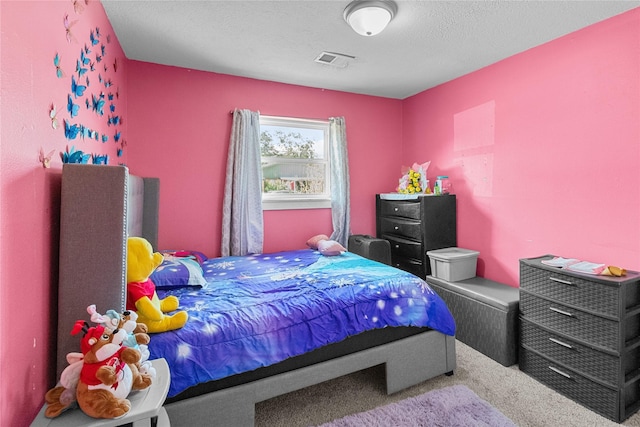 carpeted bedroom with a textured ceiling and visible vents