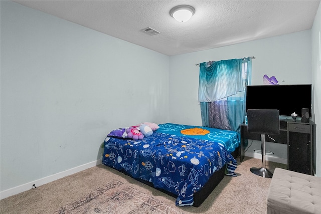 carpeted bedroom with a textured ceiling, visible vents, and baseboards