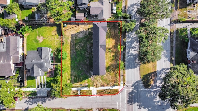 birds eye view of property with a residential view