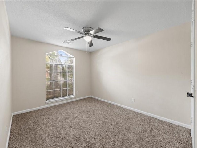 16339 Peach Orchard Dr, Humble, TX 77396 - carpeted spare room featuring ceiling fan, baseboards, and a textured ceiling