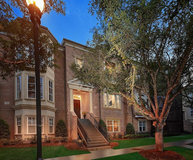 75 Colonial Row Dr, The Woodlands, TX 77380 - multi unit property featuring brick siding and a front yard