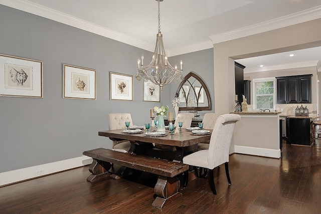 75 Colonial Row Dr, The Woodlands, TX 77380 - dining room with dark wood finished floors, ornamental molding, baseboards, and a notable chandelier