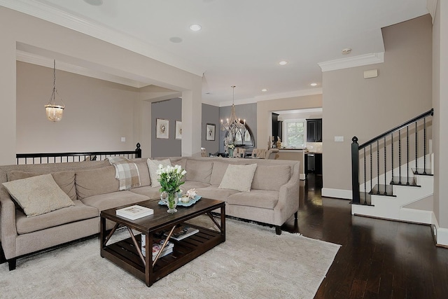 75 Colonial Row Dr, The Woodlands, TX 77380 - living area with recessed lighting, a notable chandelier, wood finished floors, stairs, and crown molding
