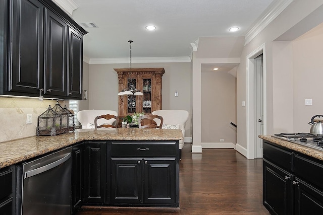 75 Colonial Row Dr, The Woodlands, TX 77380 - kitchen with ornamental molding, appliances with stainless steel finishes, dark cabinetry, and visible vents