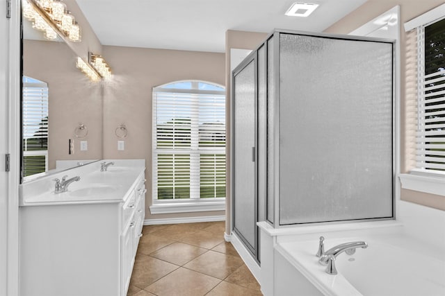 full bath with a sink, a shower stall, a notable chandelier, visible vents, and tile patterned flooring