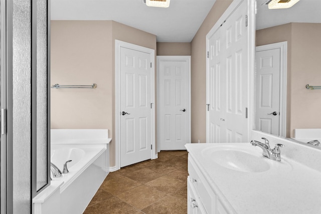 full bathroom featuring vanity and a bath