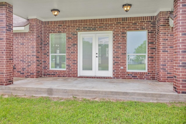doorway to property with french doors and brick siding