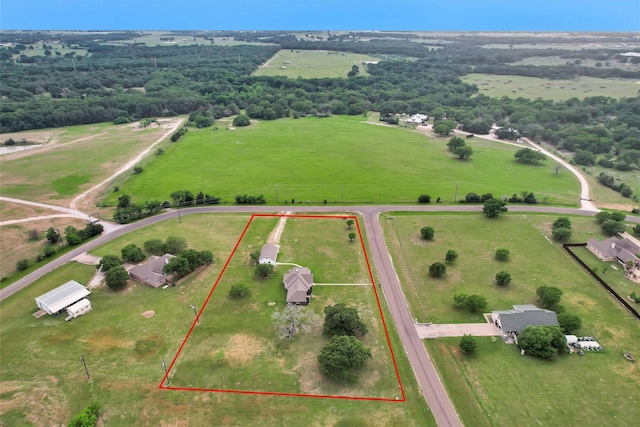 birds eye view of property featuring a rural view