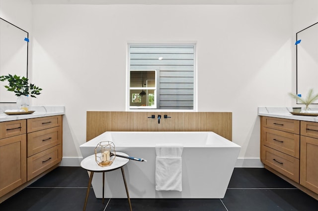 6703 Del Rio St, Houston, TX 77021 - full bath featuring tile patterned floors, vanity, and a soaking tub