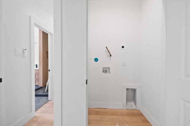 6703 Del Rio St, Houston, TX 77021 - laundry area featuring electric dryer hookup, washer hookup, and light wood finished floors