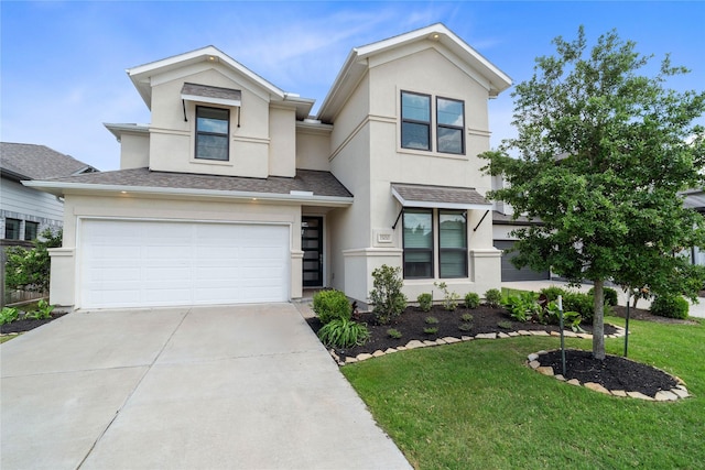 view of front of home featuring a garage, driveway, a front lawn, and stucco siding