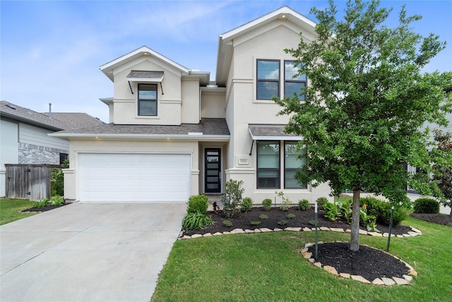 view of front of property featuring a garage, driveway, a front yard, and stucco siding