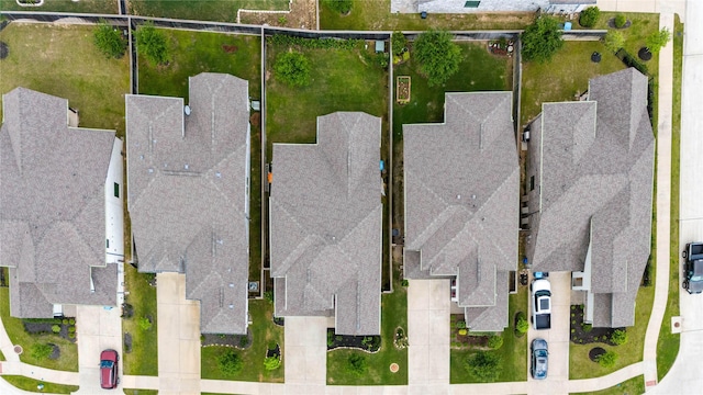 birds eye view of property with a residential view