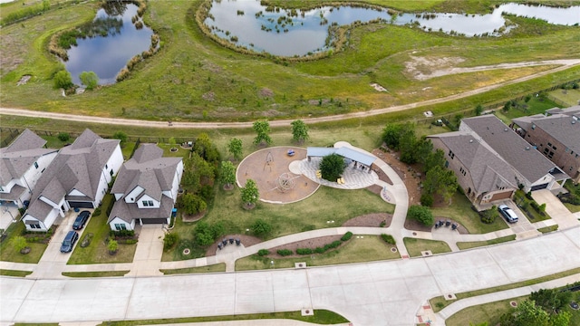 birds eye view of property featuring a water view and a residential view