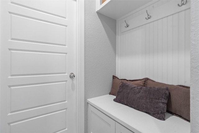 mudroom featuring a textured wall