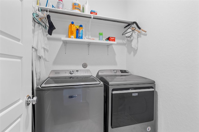 laundry area featuring washer and dryer and laundry area