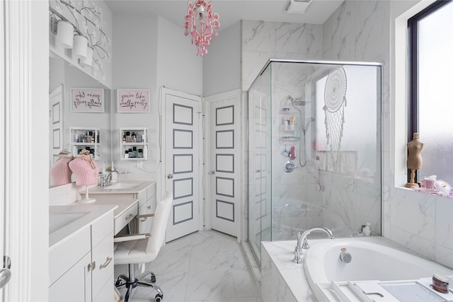 full bath with a marble finish shower, a sink, double vanity, marble finish floor, and a garden tub