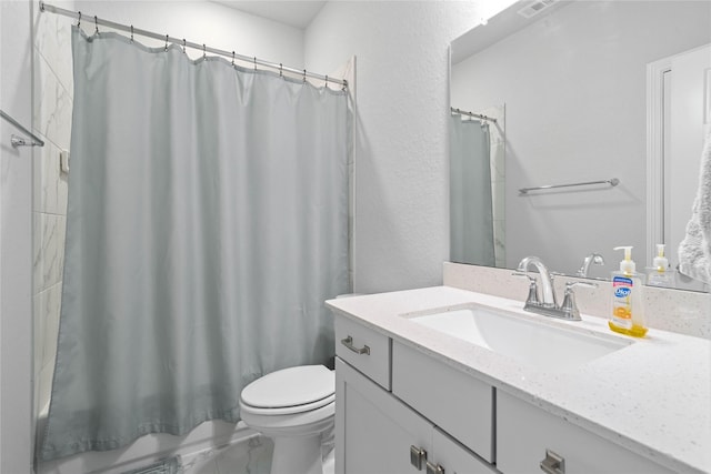 full bathroom with shower / tub combo with curtain, toilet, and vanity