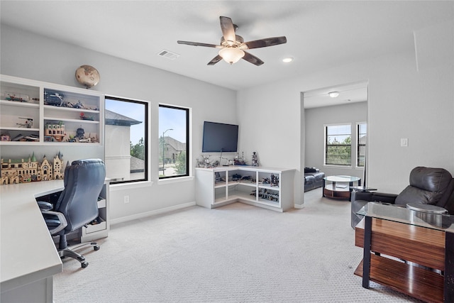 office space featuring recessed lighting, visible vents, light carpet, baseboards, and ceiling fan