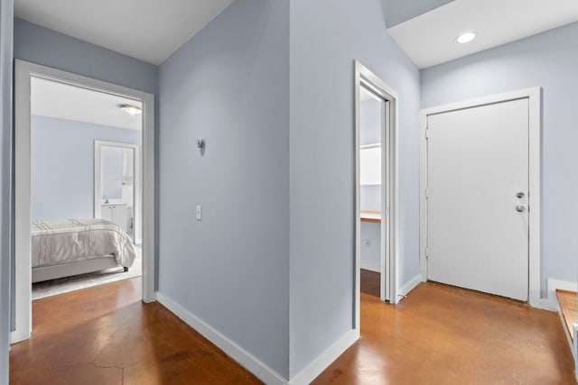 1522 Drew St, Houston, TX 77004 - corridor with baseboards, recessed lighting, and finished concrete flooring