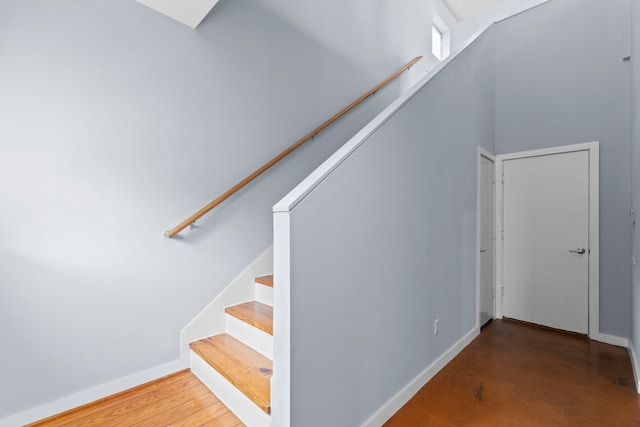 1522 Drew St, Houston, TX 77004 - staircase with baseboards and concrete flooring