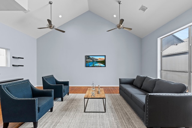 1522 Drew St, Houston, TX 77004 - living room with ceiling fan, wood finished floors, high vaulted ceiling, and baseboards