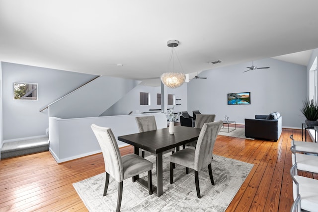 1522 Drew St, Houston, TX 77004 - dining room featuring light wood-style flooring, a ceiling fan, baseboards, and a chandelier