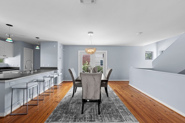 1522 Drew St, Houston, TX 77004 - dining space with plenty of natural light, hardwood / wood-style flooring, and baseboards