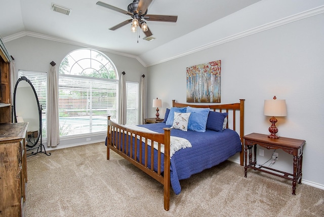 bedroom featuring lofted ceiling, visible vents, baseboards, and light carpet