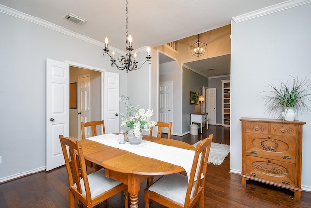 dining room with dark wood-style floors, an inviting chandelier, visible vents, crown molding, and baseboards