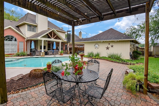 view of pool featuring fence, a pergola, outdoor dining area, and a patio area
