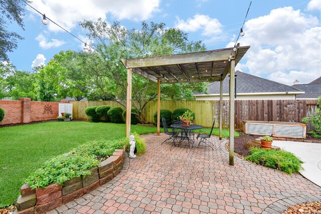 view of patio / terrace with a fenced backyard, a pergola, and outdoor dining area