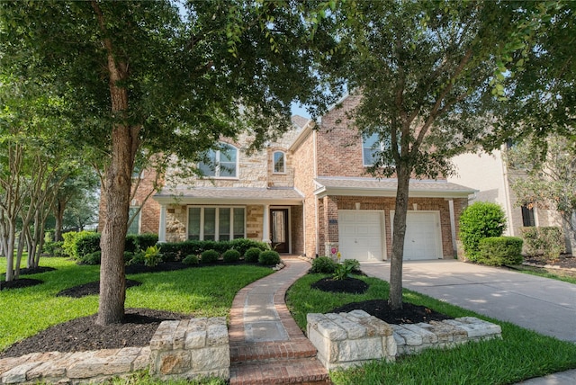 traditional home featuring driveway, a front yard, and brick siding