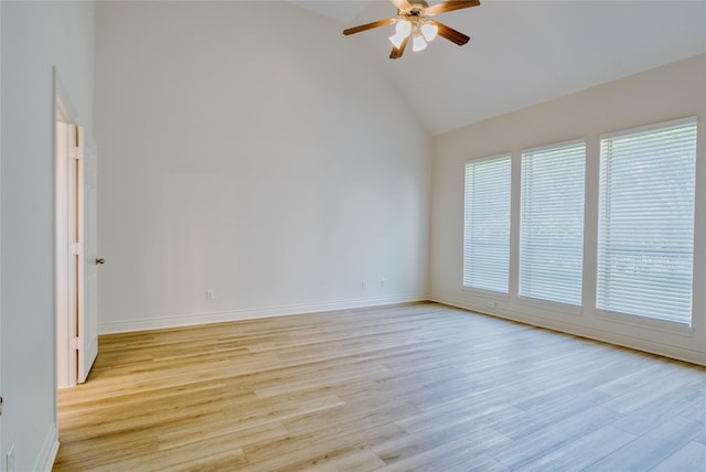 unfurnished room with baseboards, high vaulted ceiling, ceiling fan, and light wood finished floors