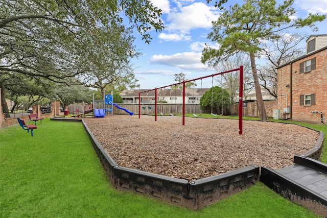 community playground with fence and a yard
