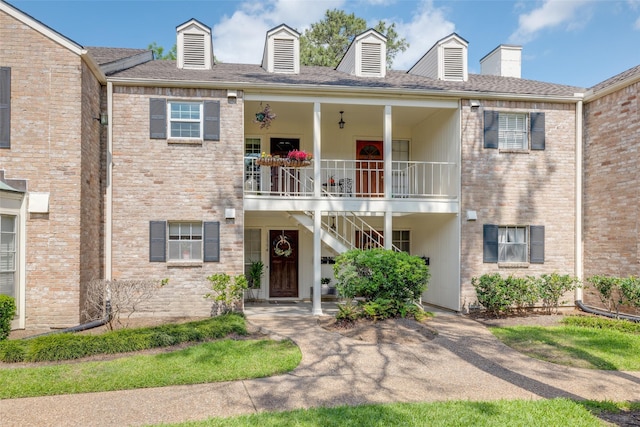 view of front of property with stairs