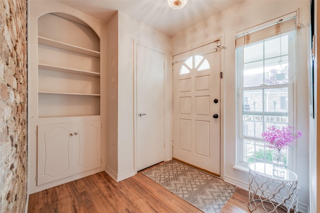 foyer entrance with light wood-style flooring