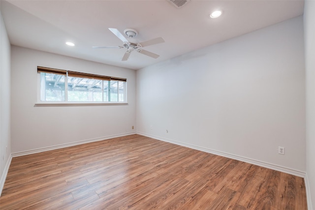 spare room featuring light wood-style flooring, baseboards, recessed lighting, and ceiling fan