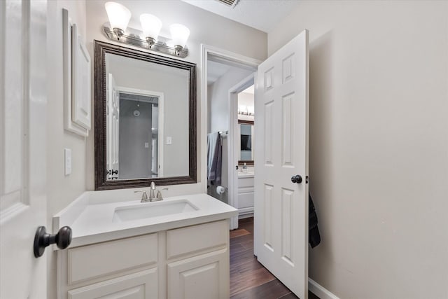 bathroom featuring vanity and wood finished floors