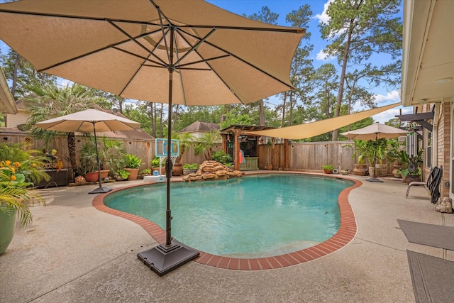 view of swimming pool with a fenced in pool, a patio, and a fenced backyard