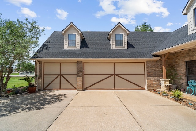 exterior space featuring brick siding and roof with shingles