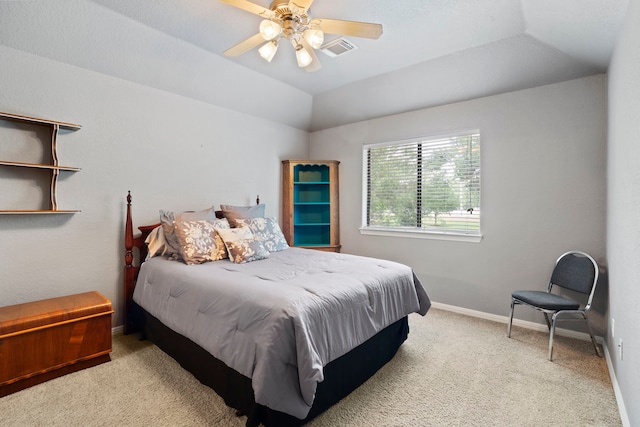 bedroom featuring carpet, vaulted ceiling, visible vents, a ceiling fan, and baseboards