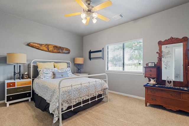 bedroom with visible vents, baseboards, a ceiling fan, and carpet flooring