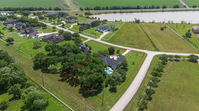 bird's eye view featuring a rural view and a water view