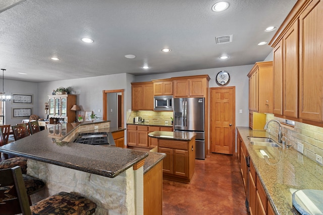 kitchen featuring tasteful backsplash, a sink, a spacious island, finished concrete flooring, and appliances with stainless steel finishes