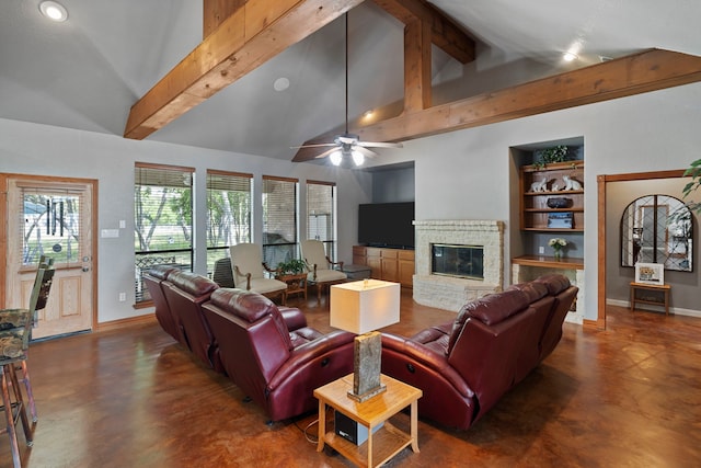 living room with concrete flooring, beam ceiling, baseboards, a glass covered fireplace, and ceiling fan