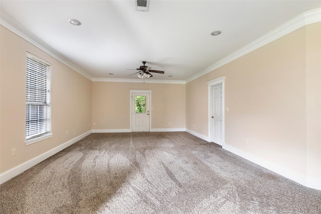 108 Harbour Town Cir, Conroe, TX 77356 - spare room with a ceiling fan, carpet, baseboards, ornamental molding, and visible vents